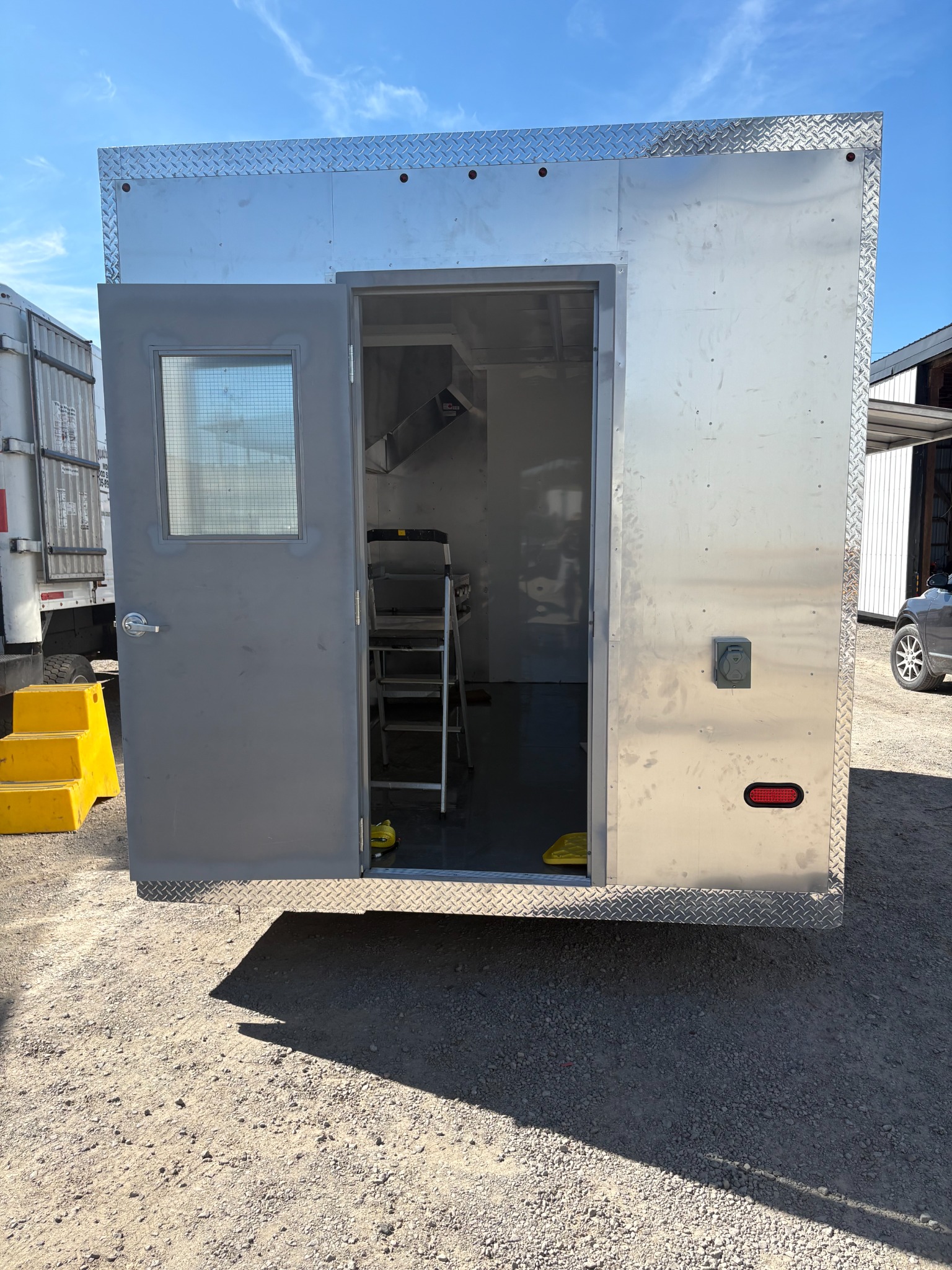 Rear of the trailer outside the workshop