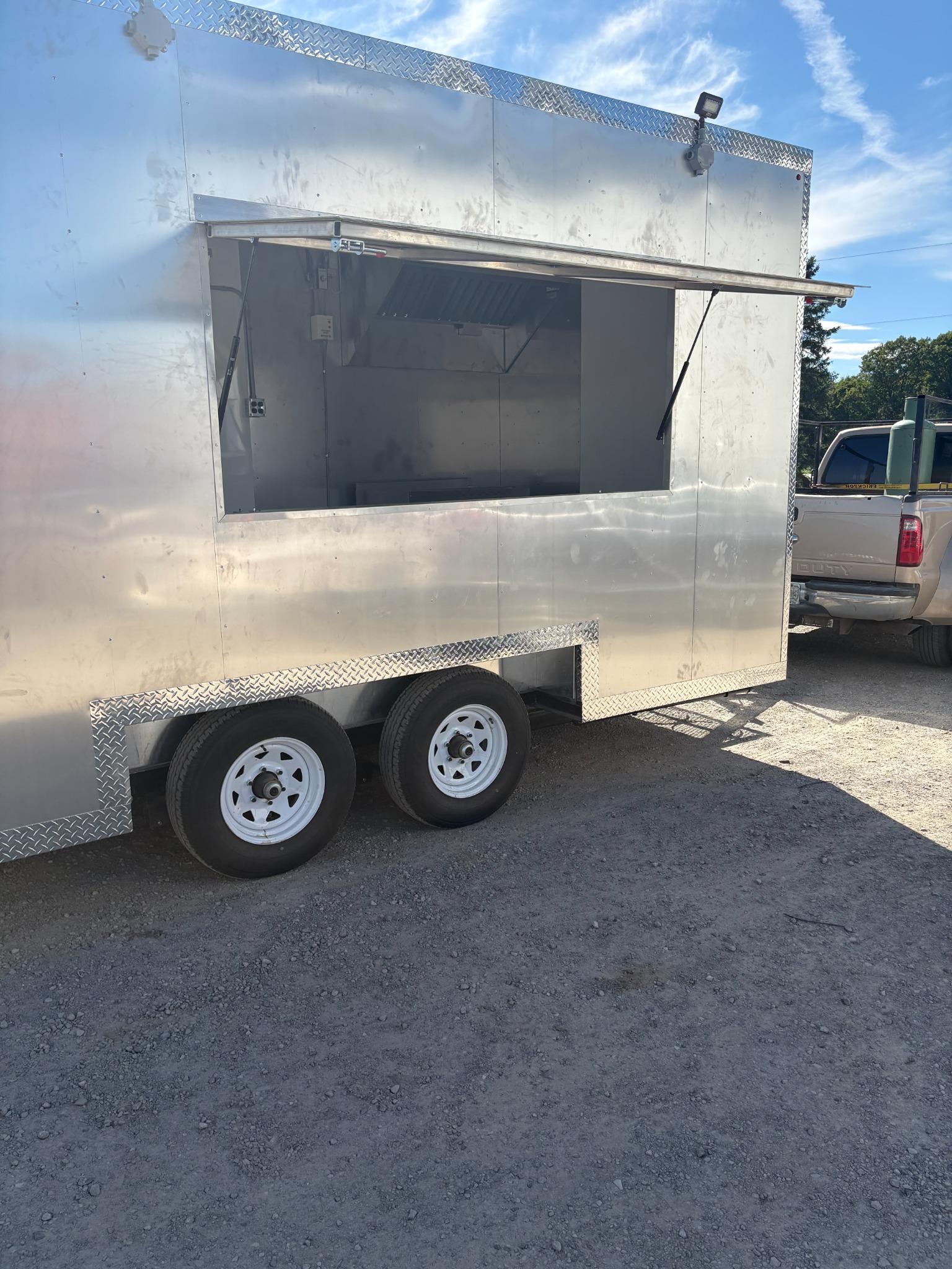 Trailer with the large serving window open outdoors